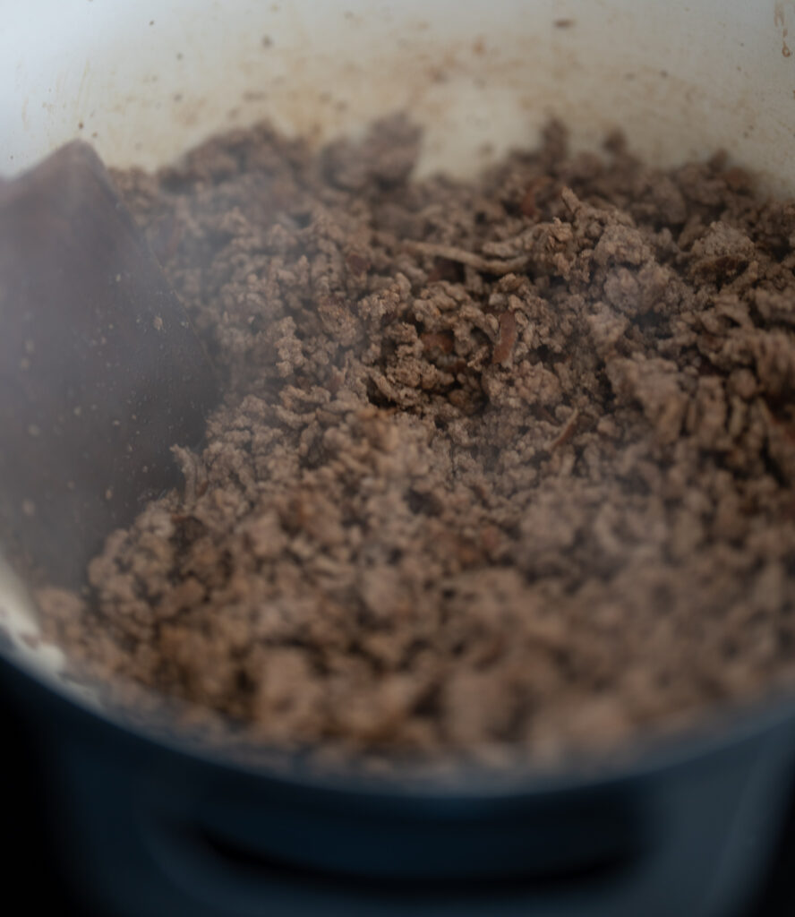cooked ground beef in a Dutch oven