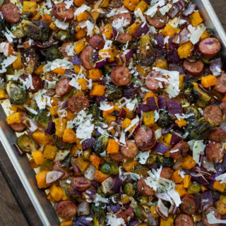 sheet pan with chicken sausage, butternut squash, brussels sprouts, and red onion