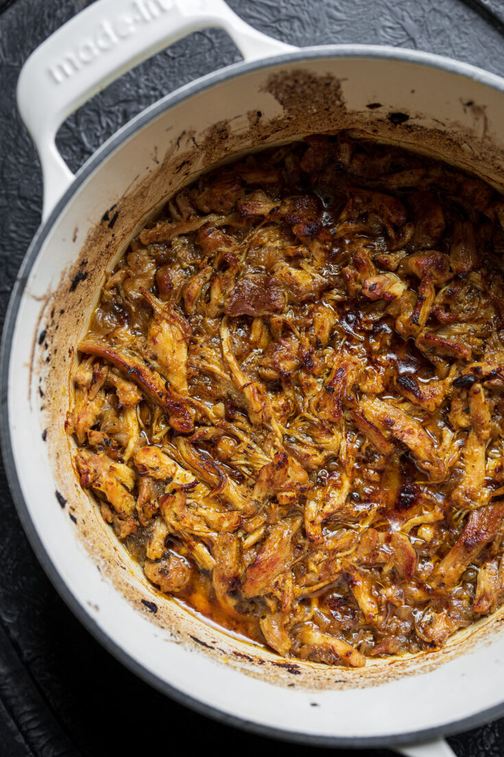 crispy pulled chicken in a Dutch oven