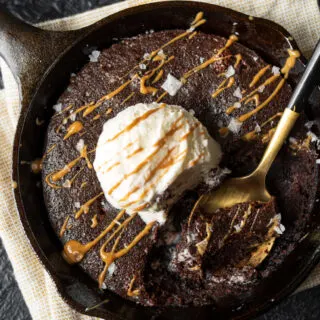 mini skillet brownie topped with ice cream and melted cookie butter